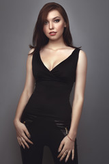 Fototapeta premium the beautiful girl poses in studio