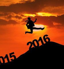 Excited woman jumps over 2016 numbers