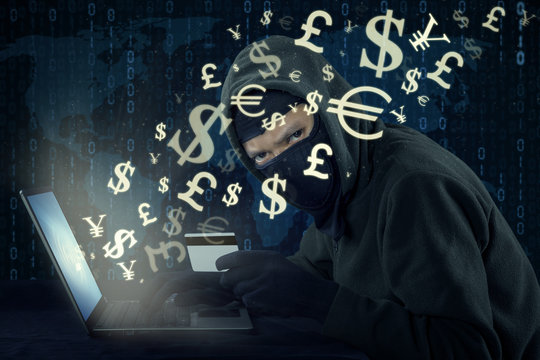 Hacker stealing money with online transaction