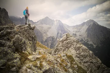 Foto op Canvas woman adventure hiker on mountain summit © santiago silver
