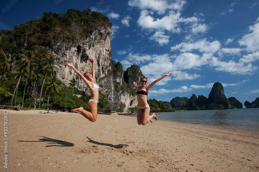 Wall mural Happy girls jump