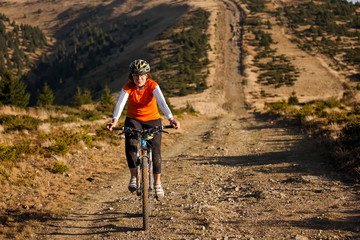 Fototapeta premium Biker riding in autumn mountains