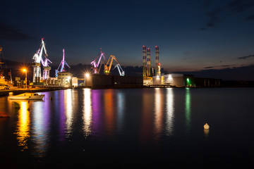 Fototapeta na wymiar Illuminated cranes in Pula, Croatia