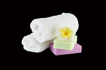 Spa treatment with soap towels and flower on white background