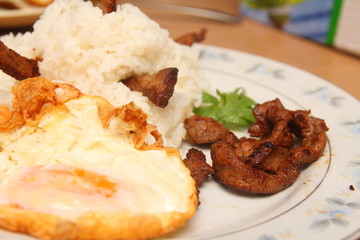 Thailand style fried rice, fried meat with garlic, pepper, put a fried egg.