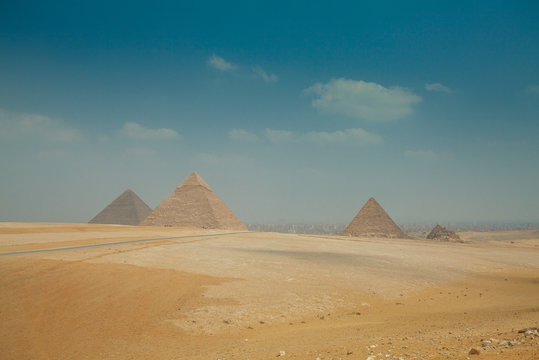 egyptian pyramids in heat yellow sands