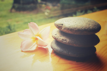 Frangipani flower with spa stones