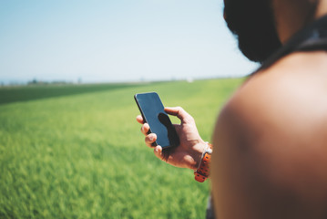 Mock up of bearded man looking in his smartphone 