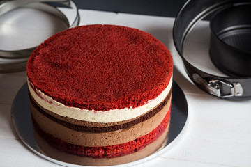 Naked layer cake with red velvet and chocolate biscuit and cream