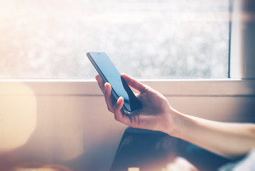 Man using his smartphone close the window with effects