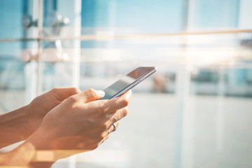 Mock up of girl using her smartphone in the city for send text