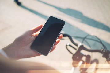 Smart phone and bicycle traveling in the city