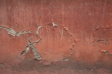 Texture of old wall covered with red stucco