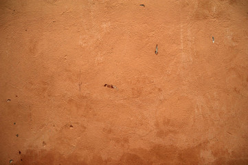 Texture of old wall covered with brown stucco