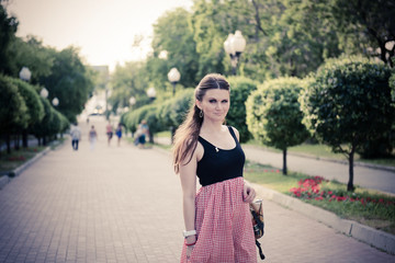 Pretty young woman outdoor with smoky eye makeup