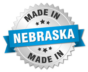 made in Nebraska silver badge with blue ribbon