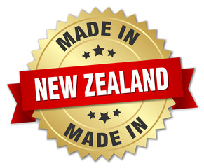 made in New Zealand gold badge with red ribbon