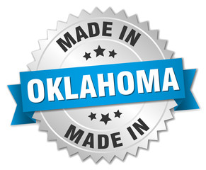 made in Oklahoma silver badge with blue ribbon