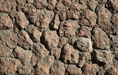 Wall texture of rough-processed red stones