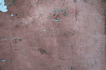 Texture of old wall covered with pink stucco