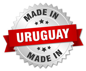 made in Uruguay silver badge with red ribbon