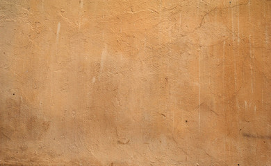 Texture of old wall covered with brown stucco