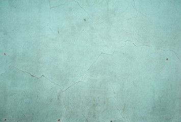 Texture of old wall covered with green stucco