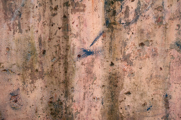 Texture of old wall covered with pink stucco