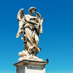 Fototapeta na wymiar Angel sculpture from St Angelo bridge in Rome, Italy.