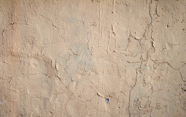 Texture of old wall covered with brown stucco