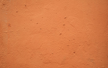 Fototapeta premium Texture of old wall covered with brown stucco