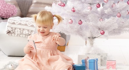 Fototapeta premium Cute little girl at christmas eve