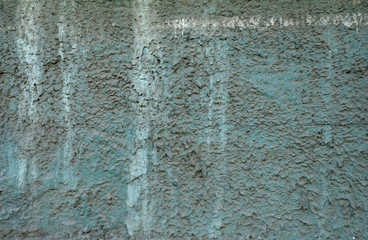 Texture of old wall covered with green stucco