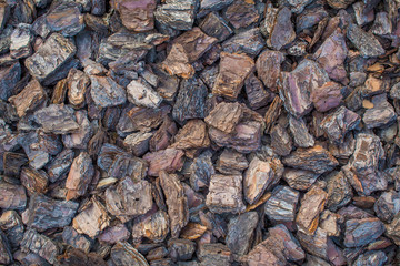 Tree bark mulch. Shredded brown tree bark for decoration and mulching. Background texture closeup
