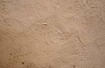 Texture of old wall covered with brown stucco