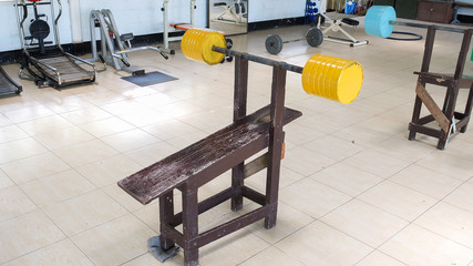 Hand Made Barbell made from Wood and Cement in The Public Local Gym