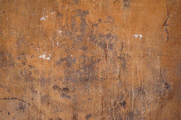 Texture of old wall covered with brown stucco