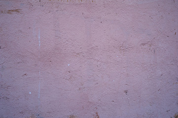Texture of old wall covered with pink stucco