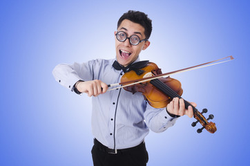 Fototapeta premium Funny man with violin on white