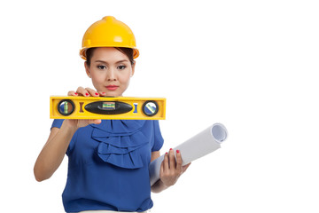Asian engineer woman with blueprints and level