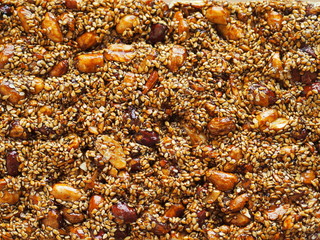 Sweet snack from Cyprus - sesame seeds in honey with almonds and peanuts. 