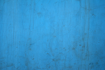Texture of old wall covered with blue stucco
