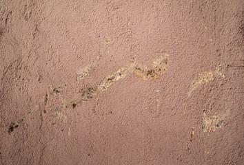Texture of old wall covered with pink stucco