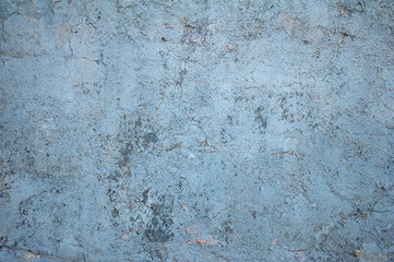 Texture of old wall covered with blue stucco