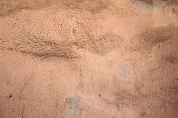 Texture of old wall covered with brown stucco