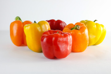 colourful garden peppers on a white background 