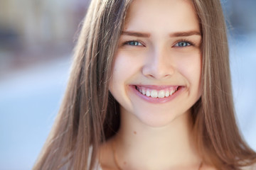 CloseUp of natural beauty smiling teen face