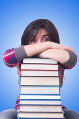 Girl student with books on white