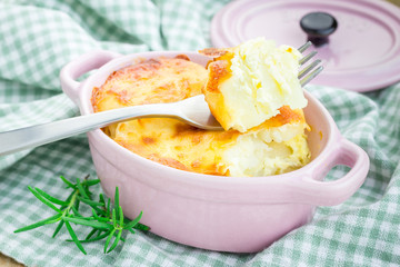 Potato gratin in ceramic mini cocotte