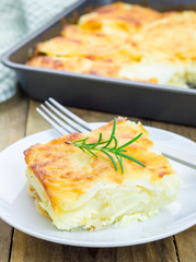 Potato gratin on a white plate
